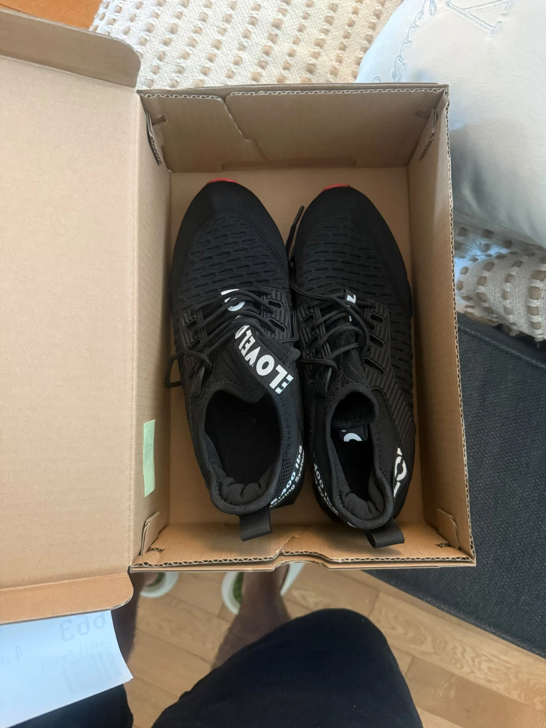 Black Athletic Shoes with Red Soles