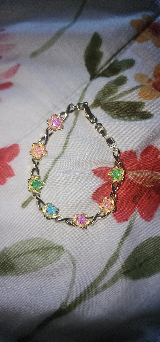 Gold plated bracelet with colorful floral charms