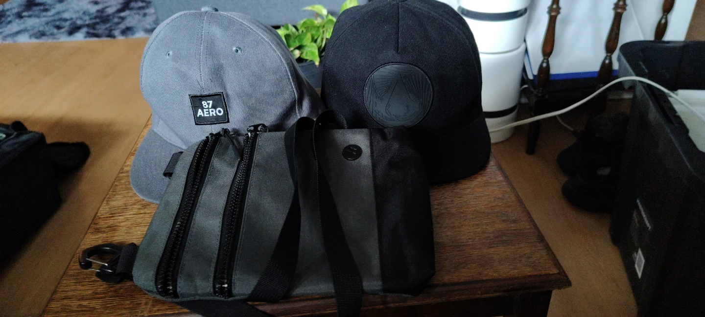 Two Hats and a cross Bag