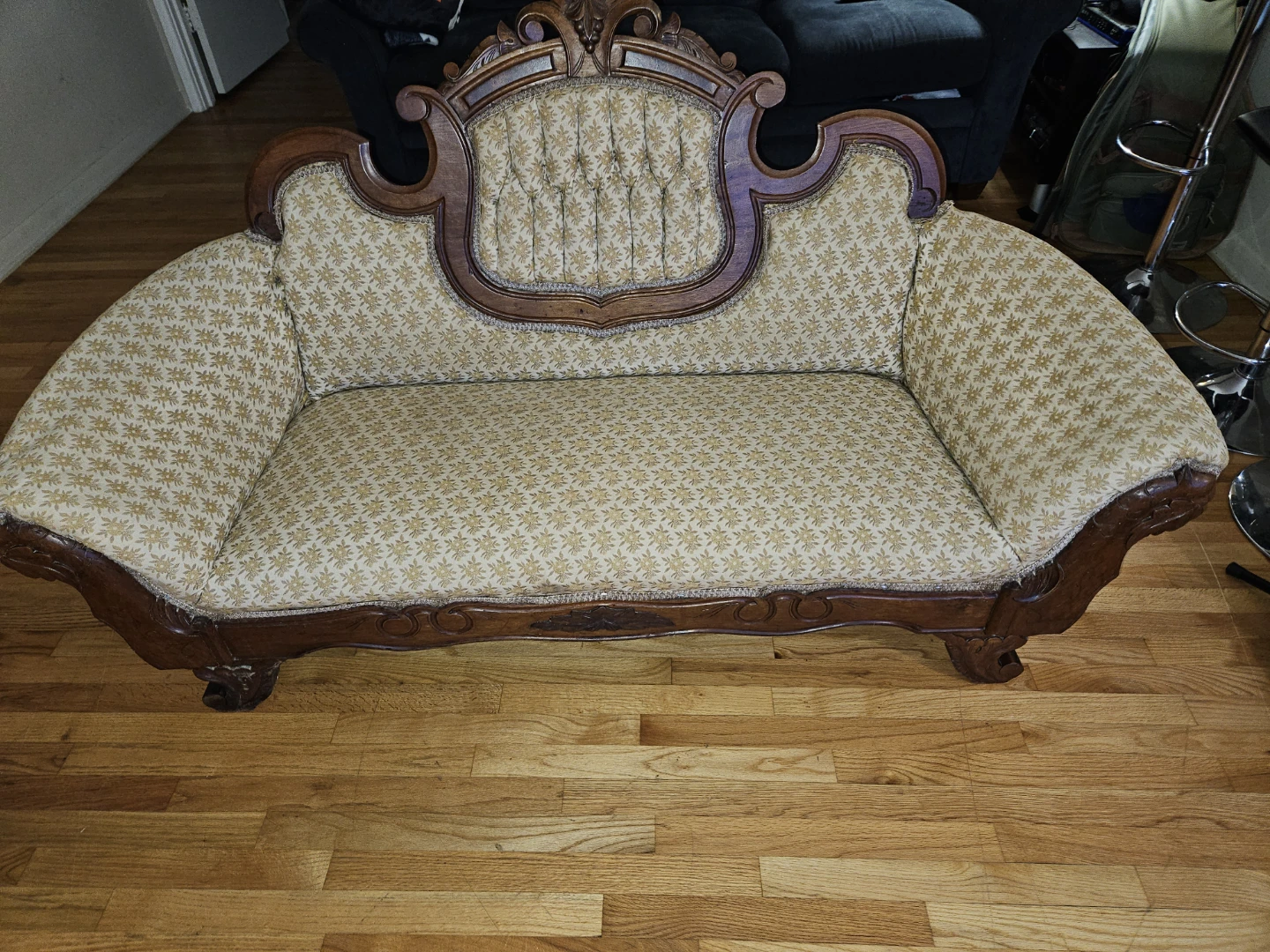 The piece is a Victorian-style parlor sofa or settee