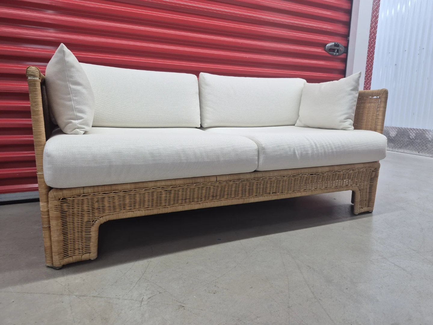 Woven wicker sofa with white cushions - photo 3