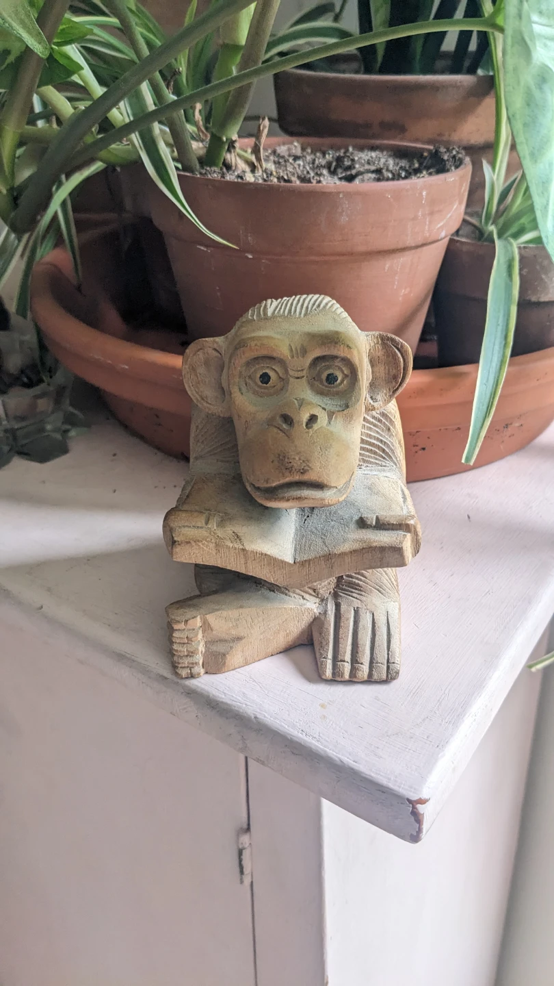 Carved wooden monkey figurine