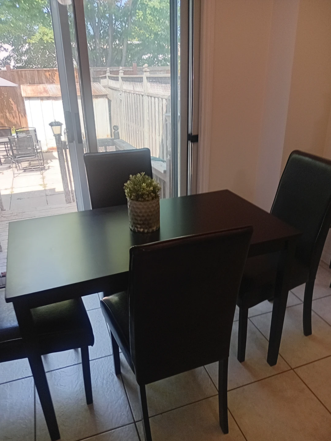 Solid wood black table and 4 upholstered chairs