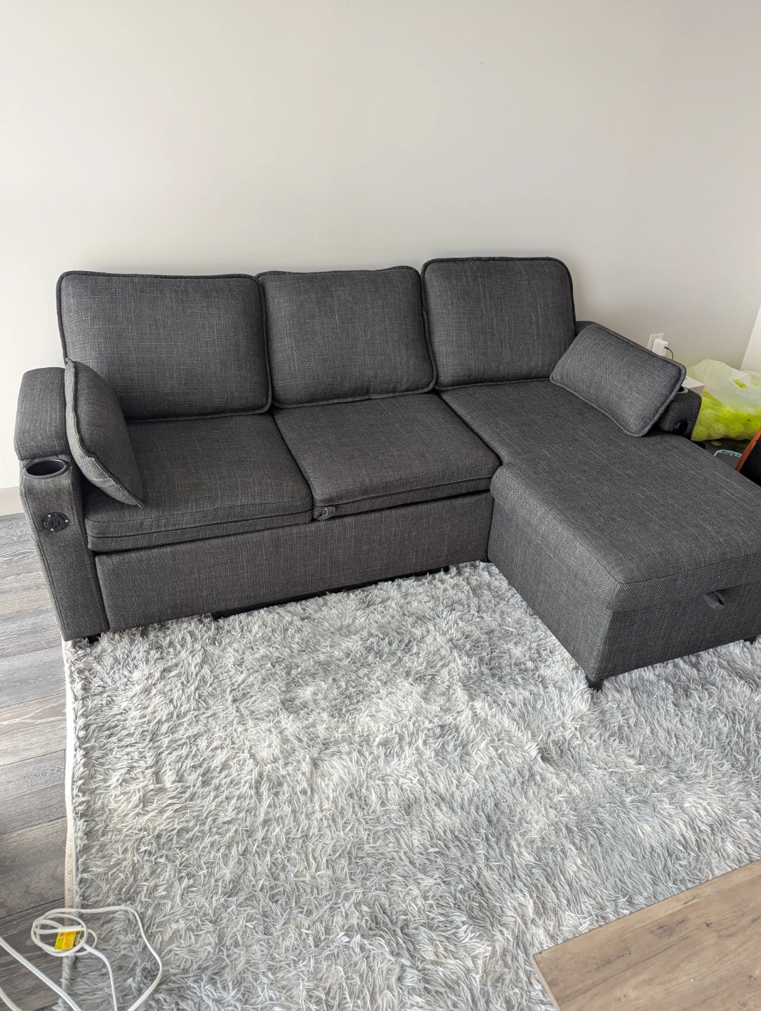 Dark grey sectional sofa with storage