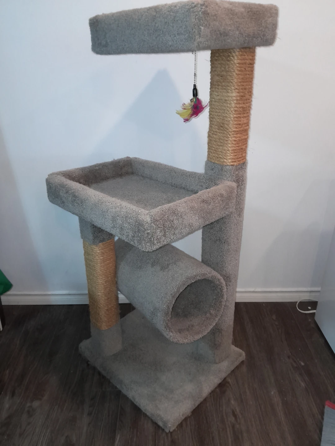 Cat tower with a bell