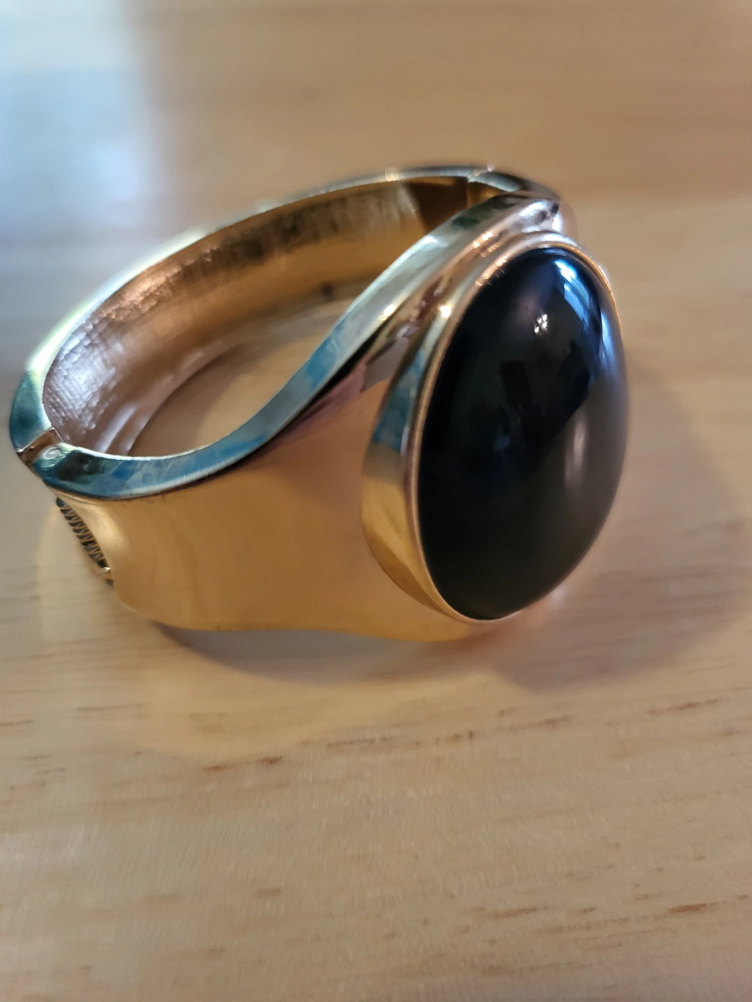 Gold tone cuff bracelet with black stone accent - photo 2