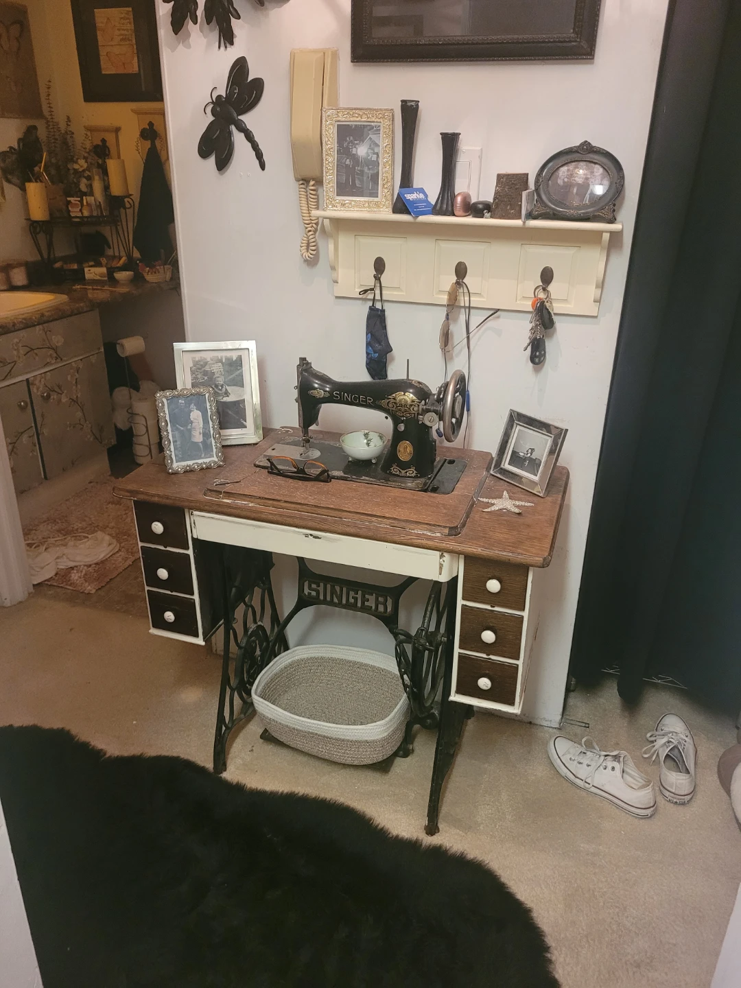 Vintage Singer sewing machine with wooden desk