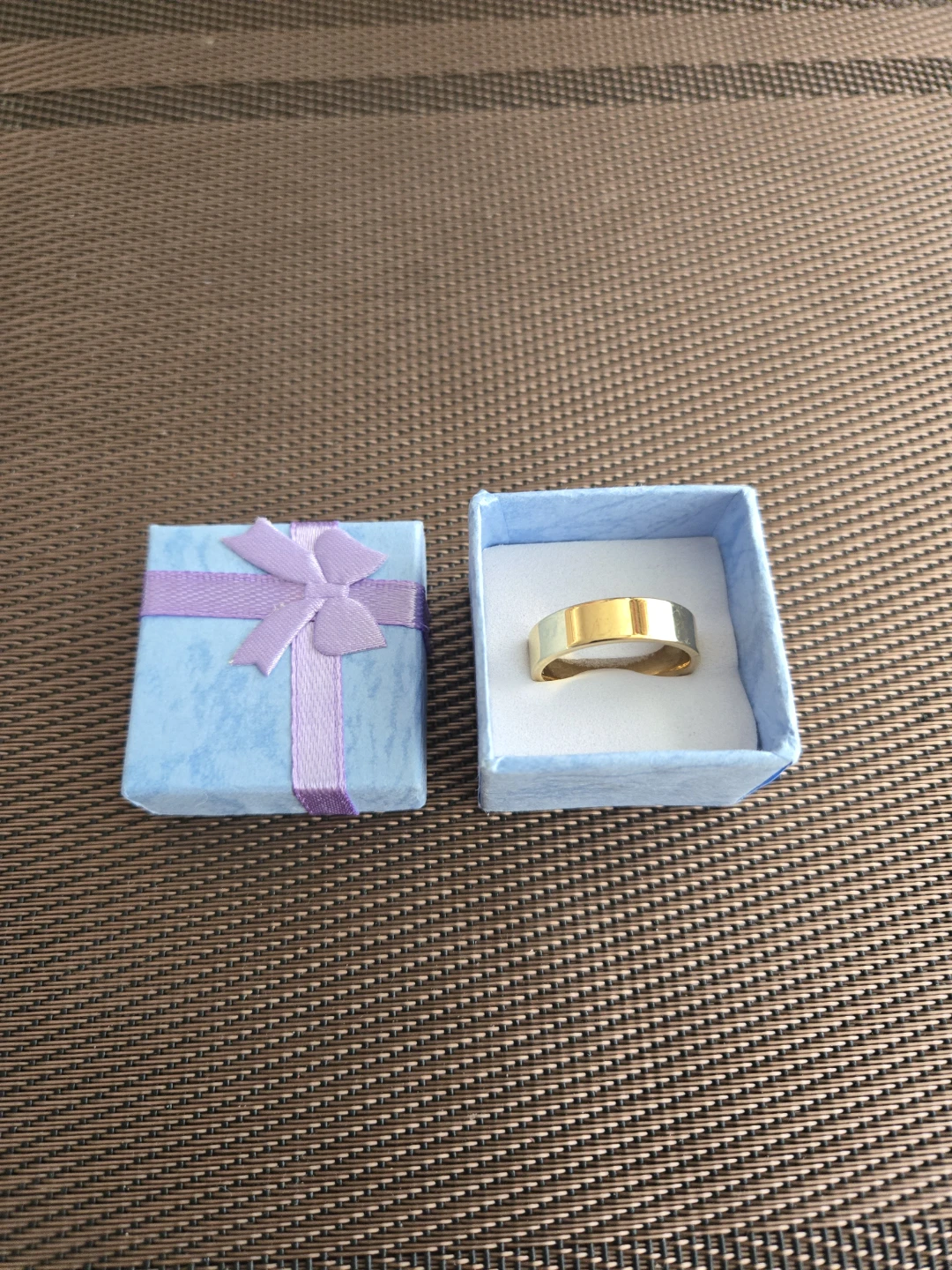 Gold band ring in gift box