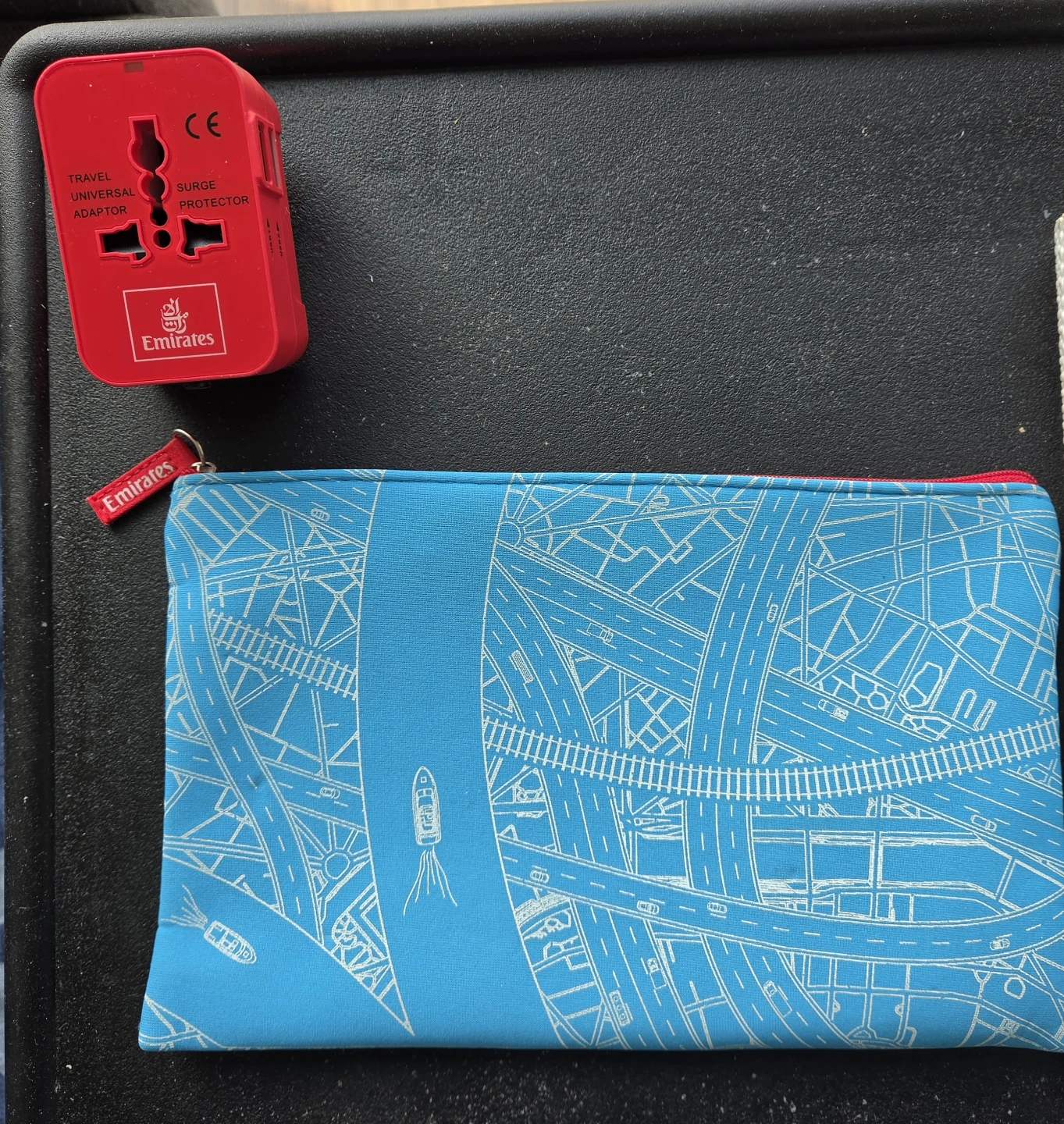 A limited edition EMIRATES branded world travel adaptor