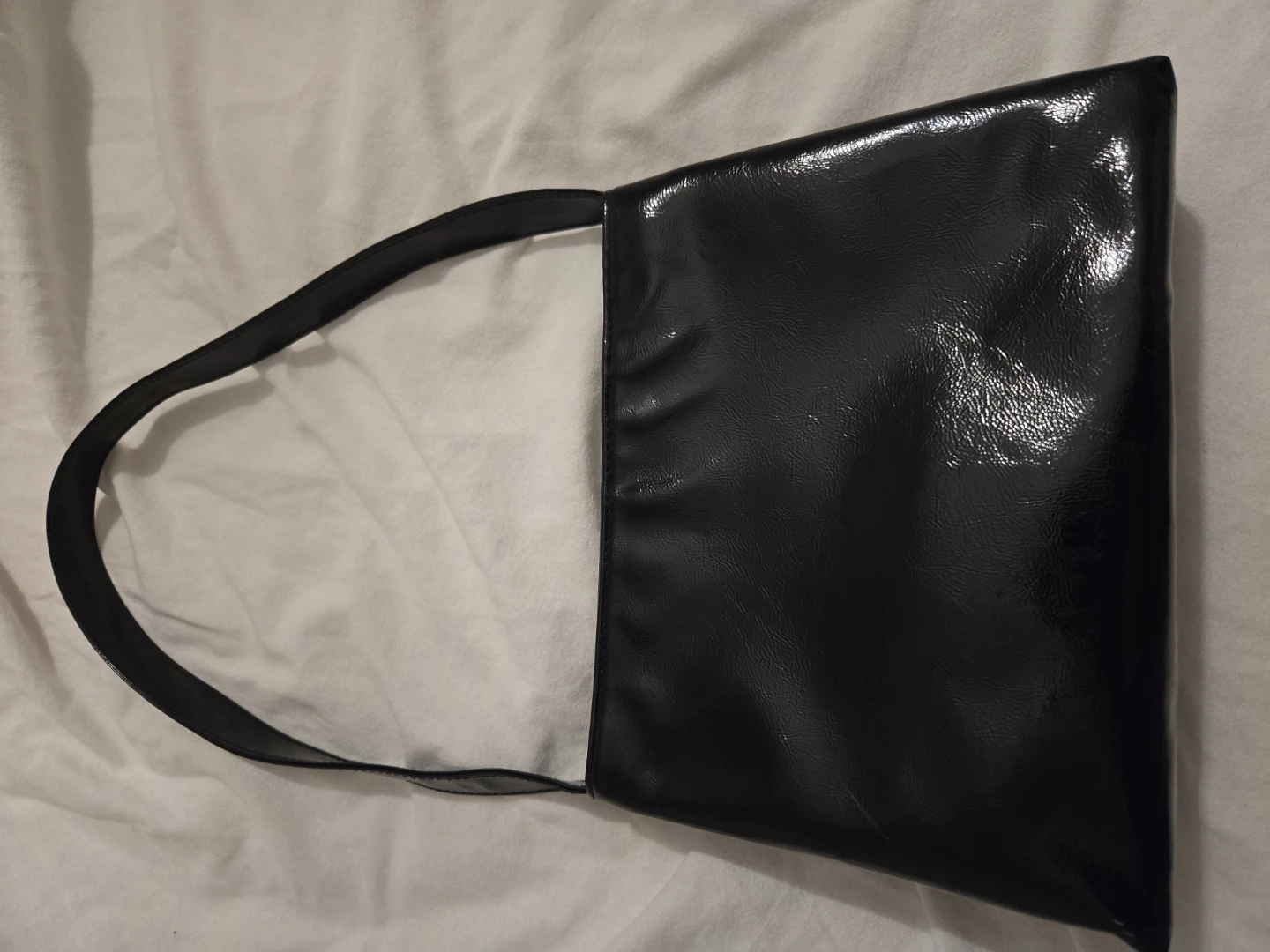 Black patent handbag