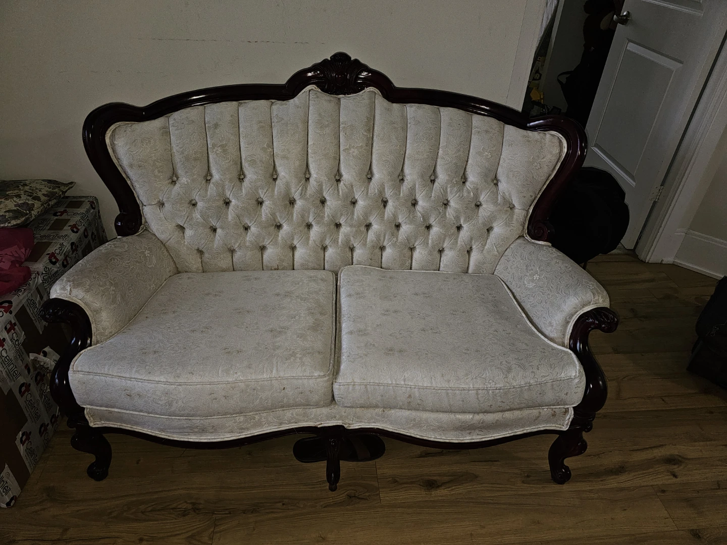 Vintage White Tufted Sofa with Carved Wood Trim