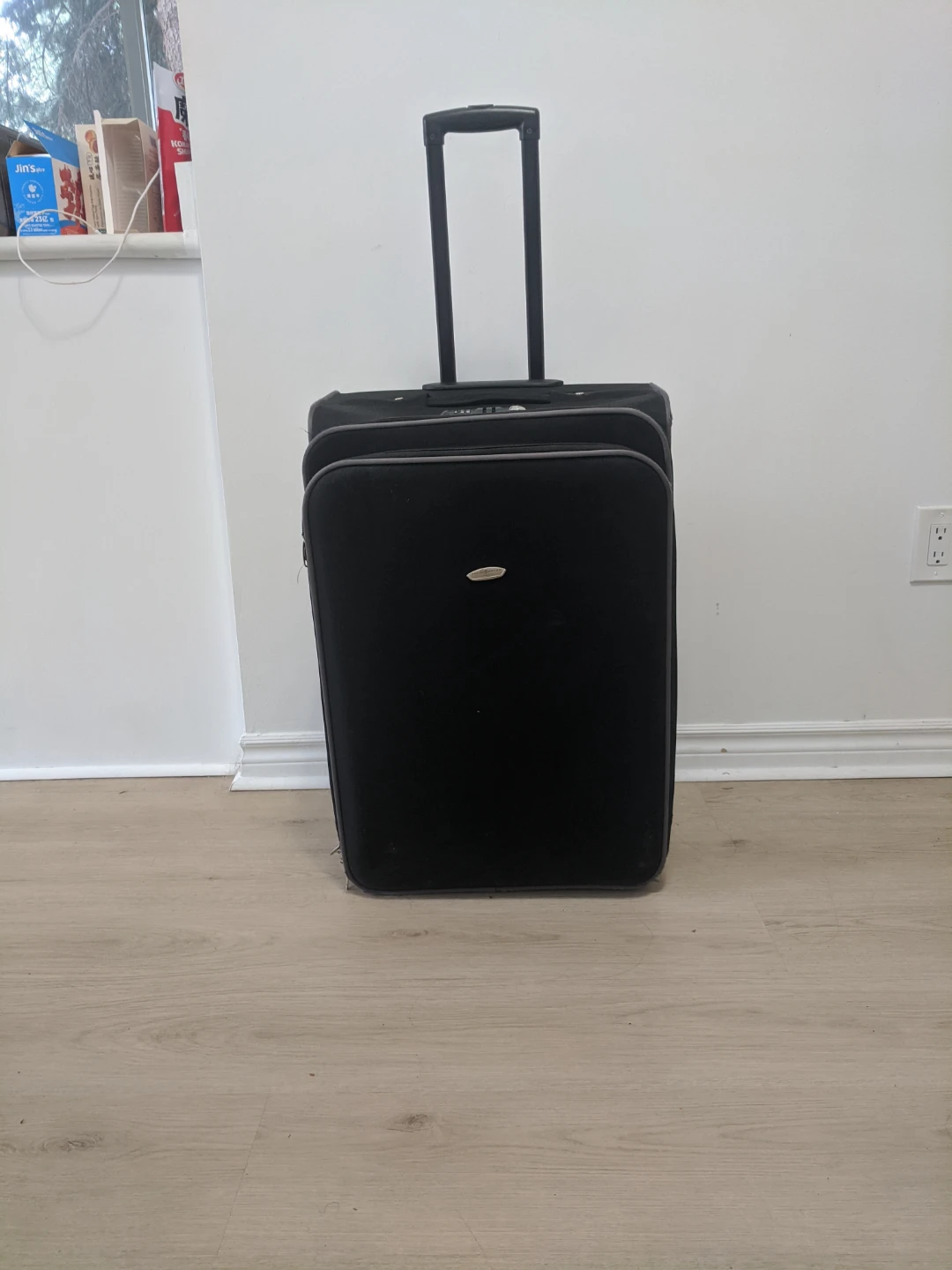 Old Black Wheels Suitcase
