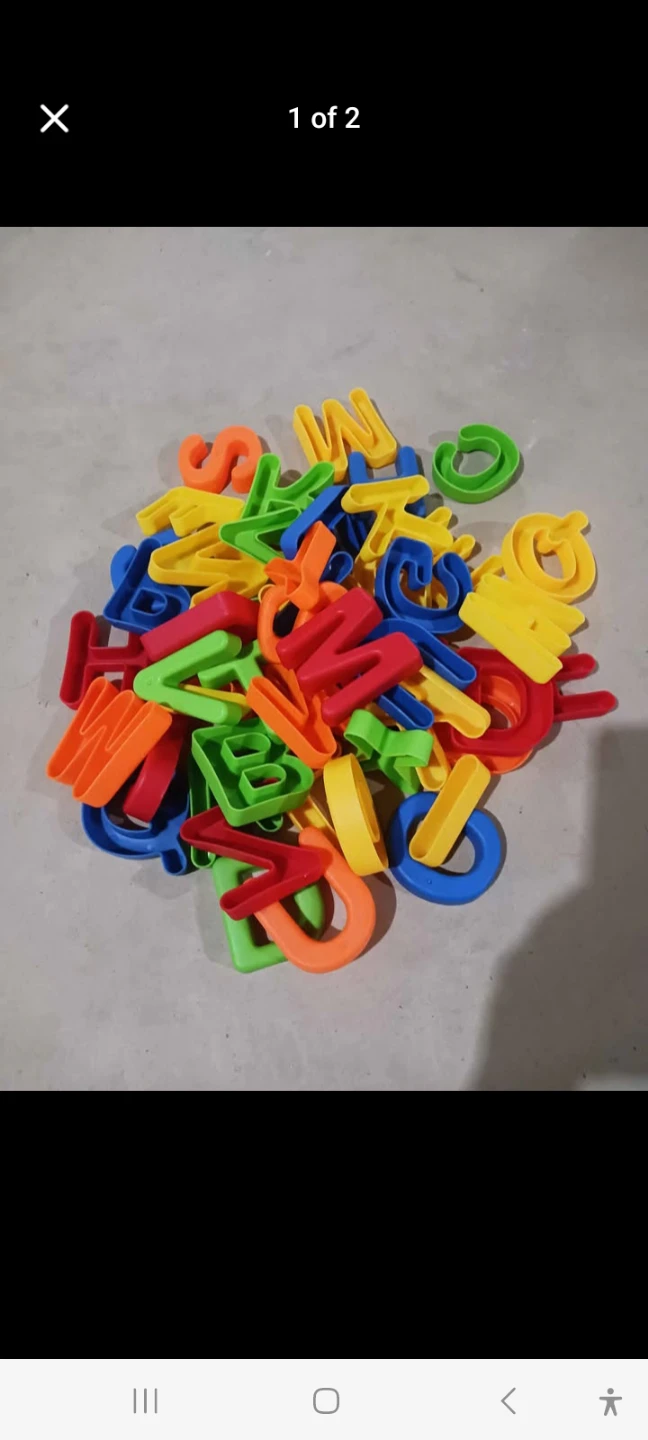 Assorted children's toys and plastic alphabet set