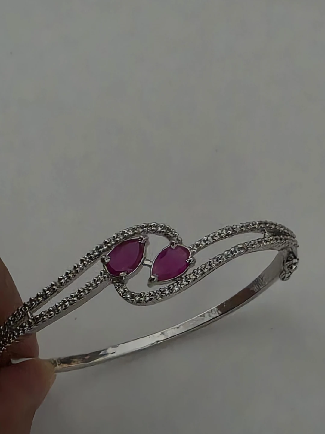 Silver-toned bracelet with pink stones