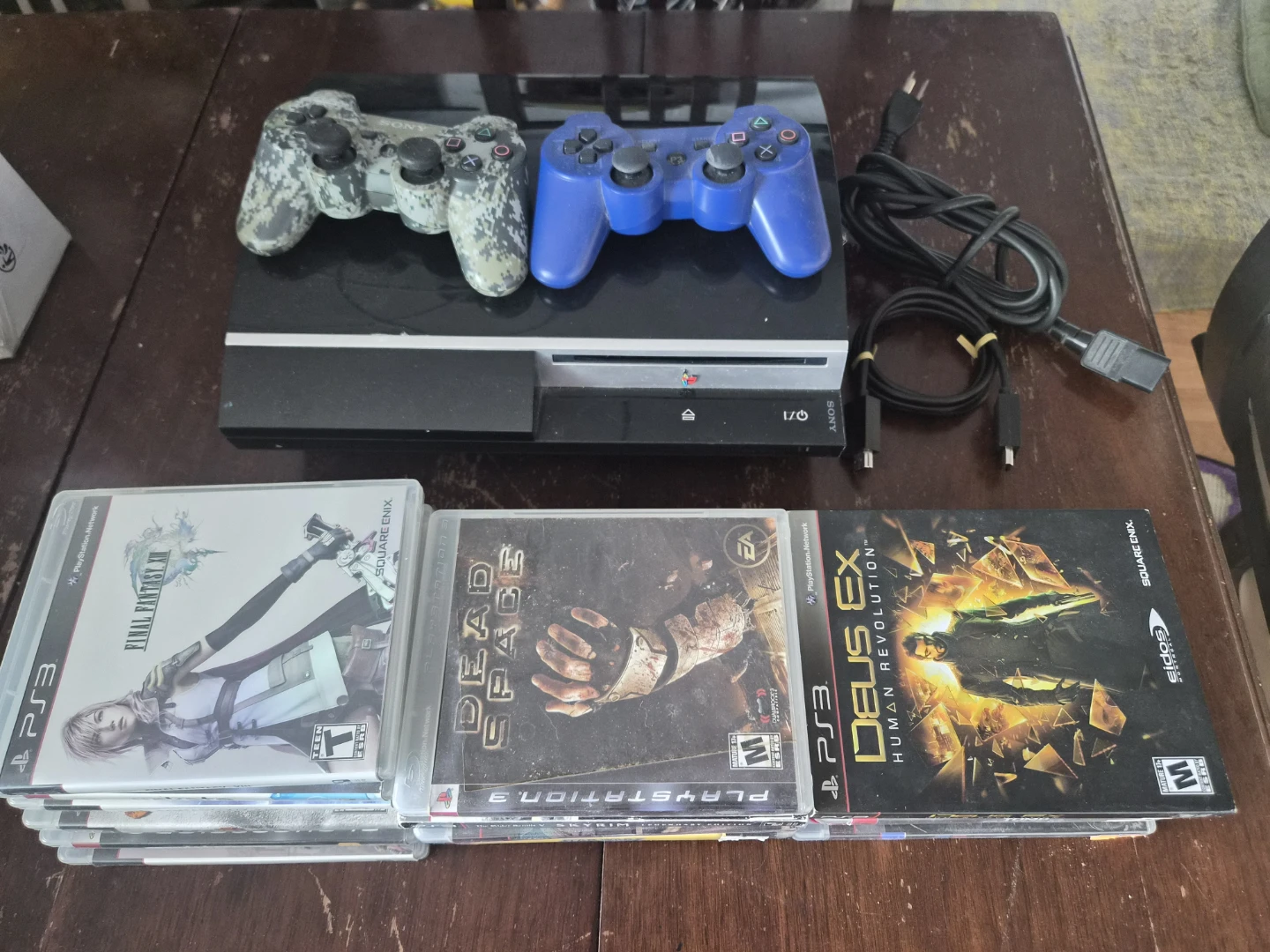 Sony PlayStation 3 Console with Games and Controllers
