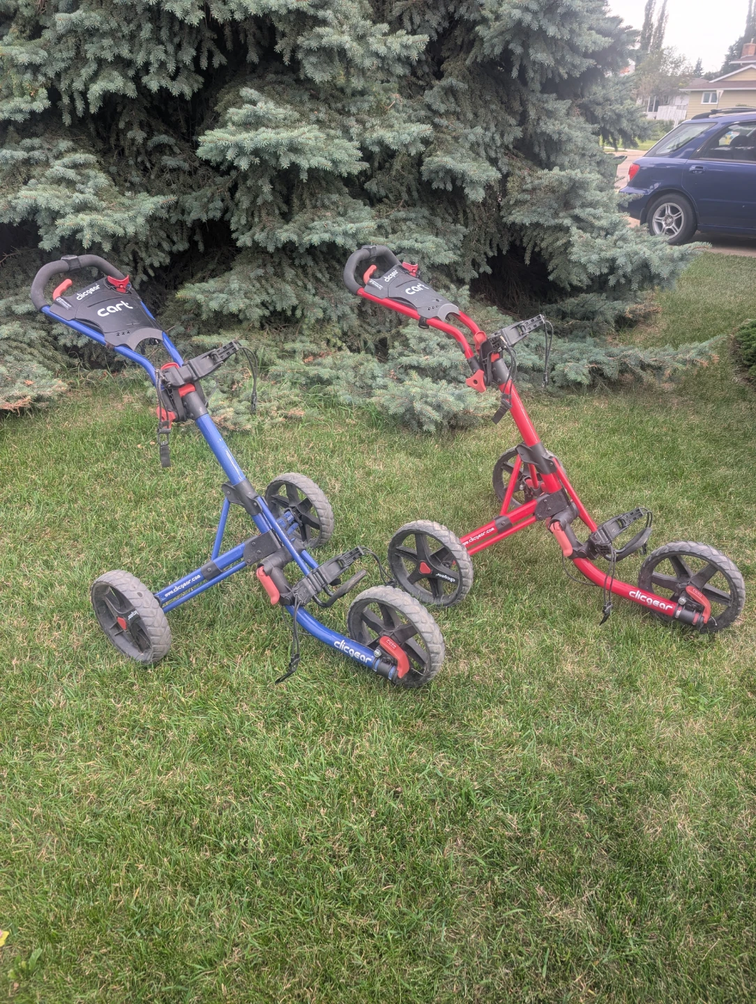 2 Clicgear Golf Push Carts - Blue and Red