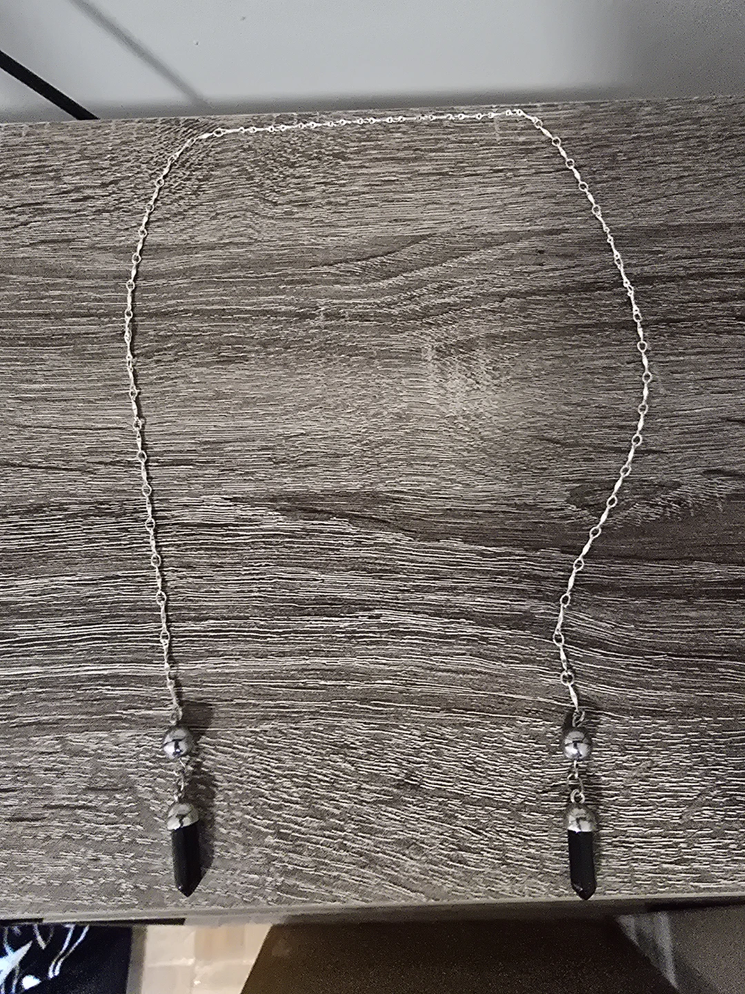 Silver Tone face chain with Black Crystal Drop
