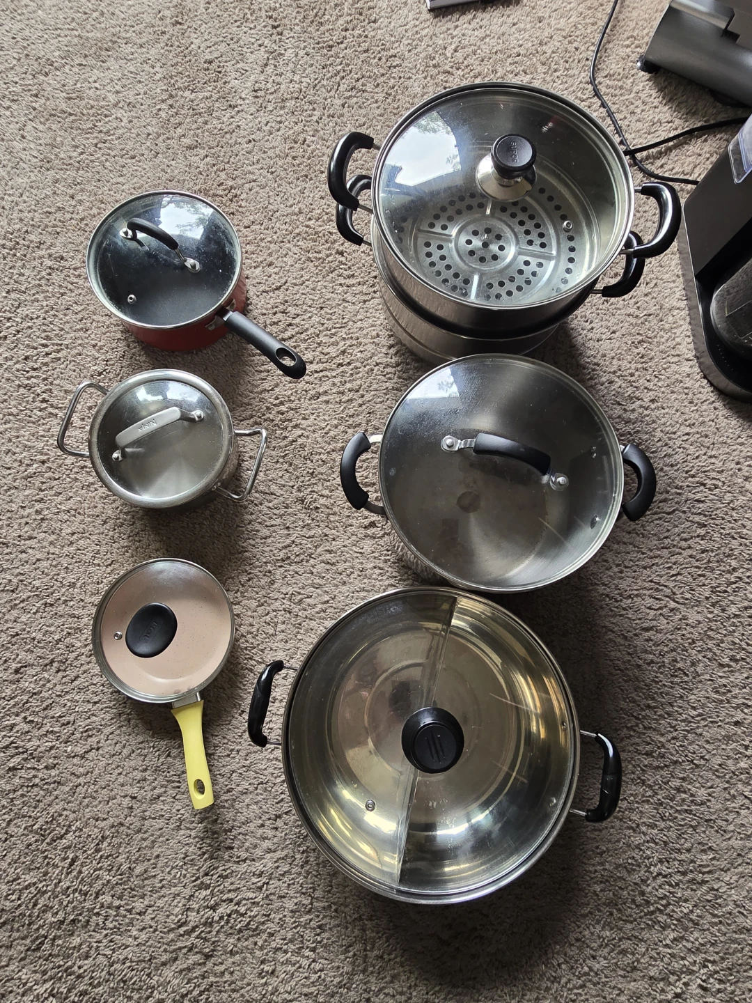 Stainless steel pots and non-stick pans in the kitchen