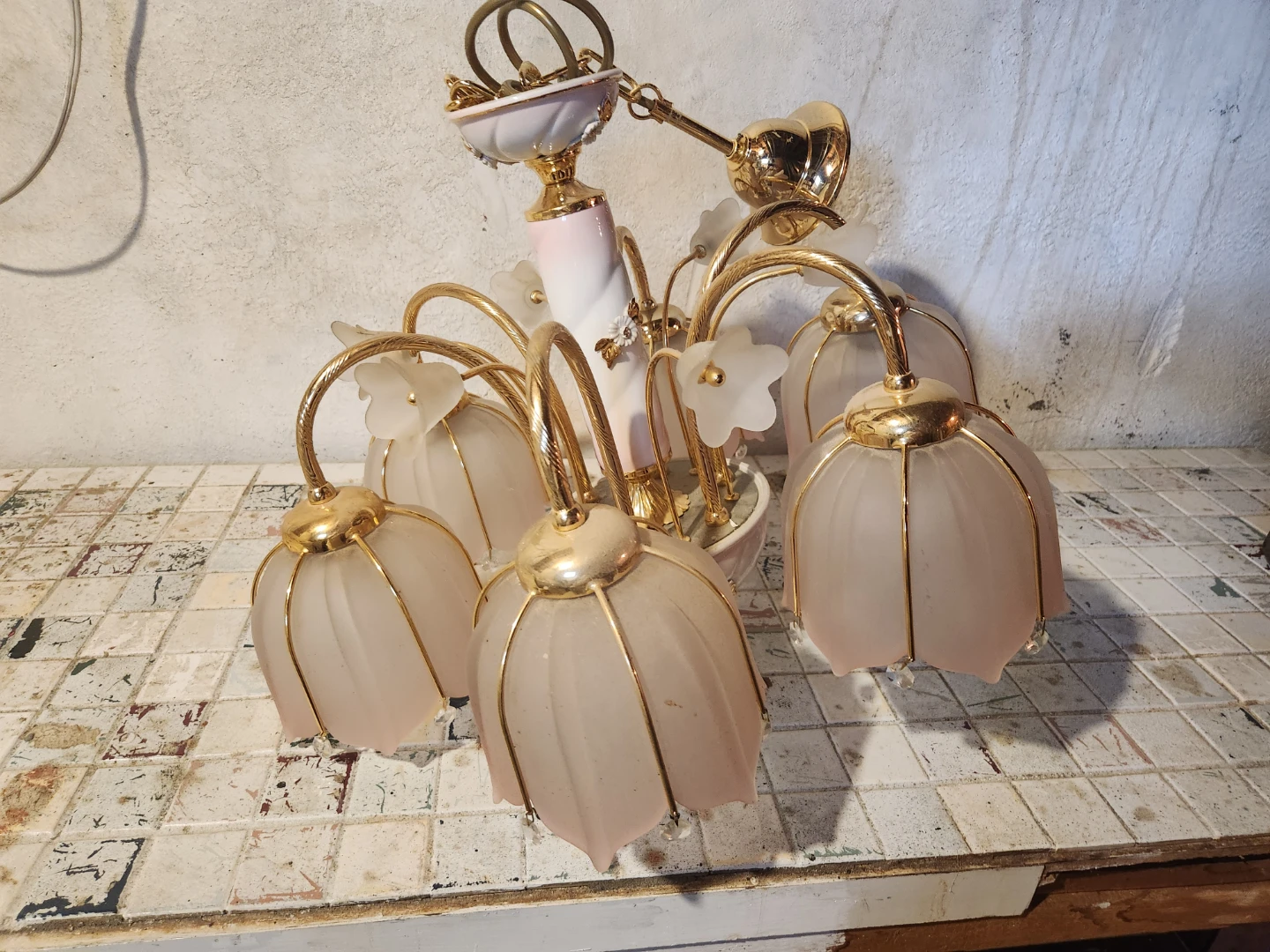Chandelier with pink glass floral shades and gold accents
