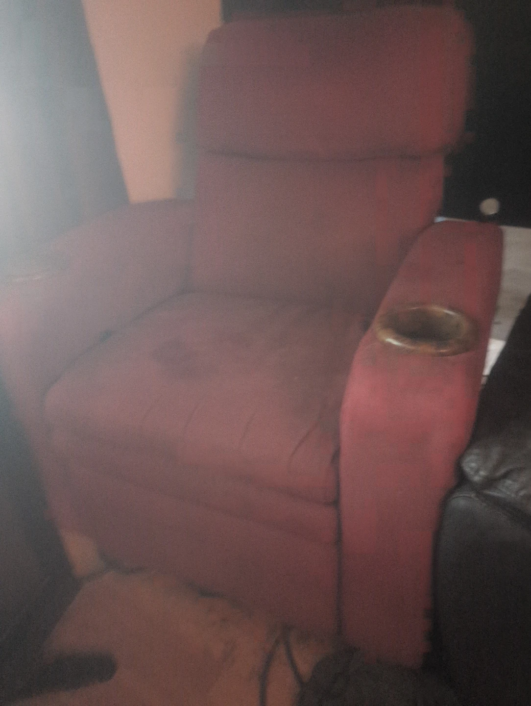 Red fabric recliner chair with cup holder. Electric