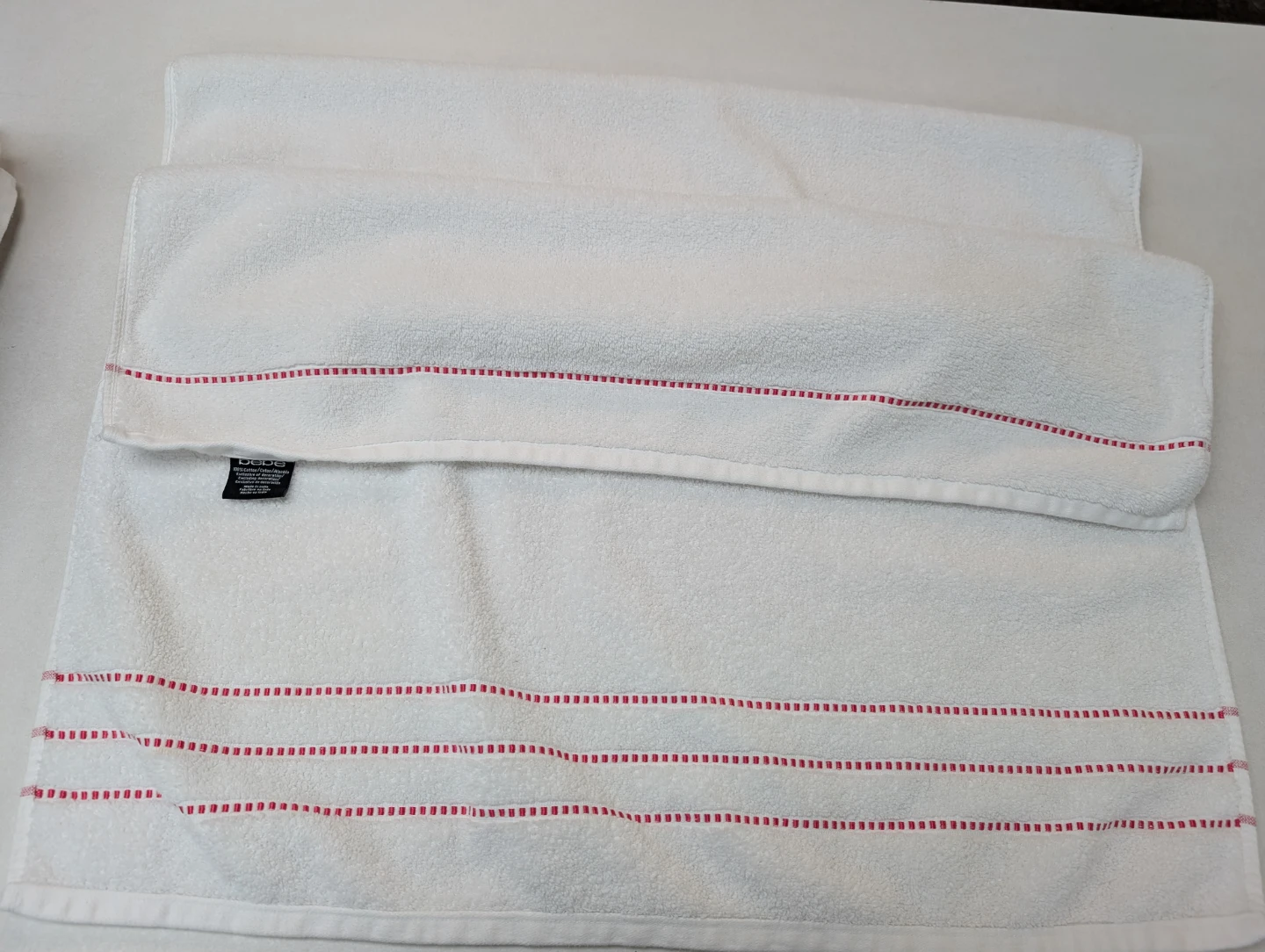 Used Bebe White Cotton Bath Towel with Red Stripes for stayover