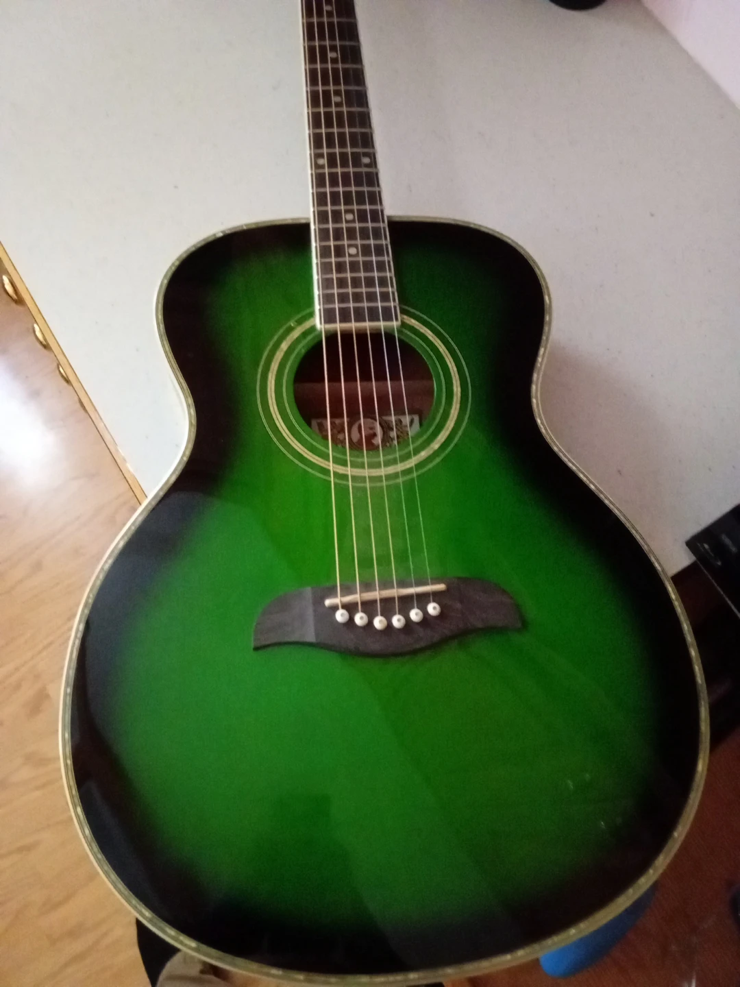 Green Oscar Schmidt six string guitar