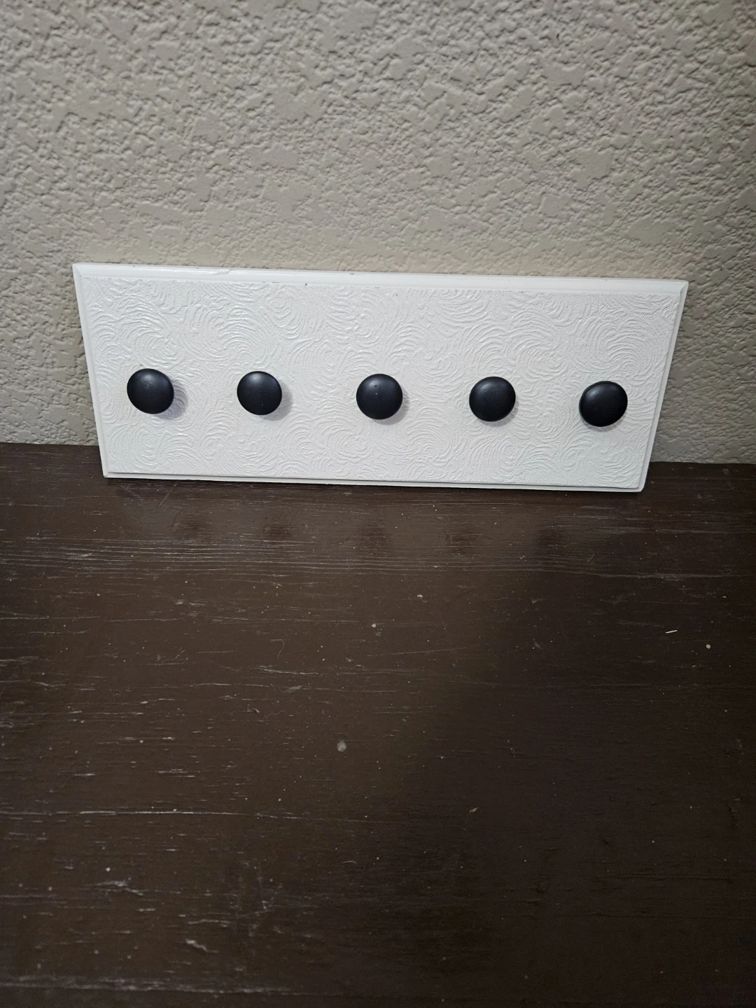 White Coat Rack with 5 Black Knobs