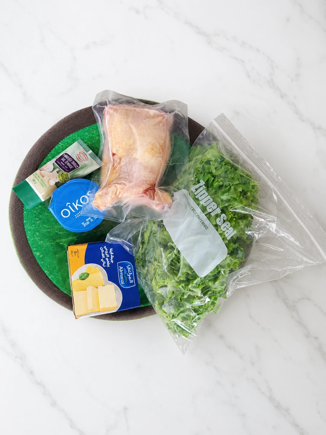 Oikos Yogurt and Almarai Cheese with Chicken and Greens