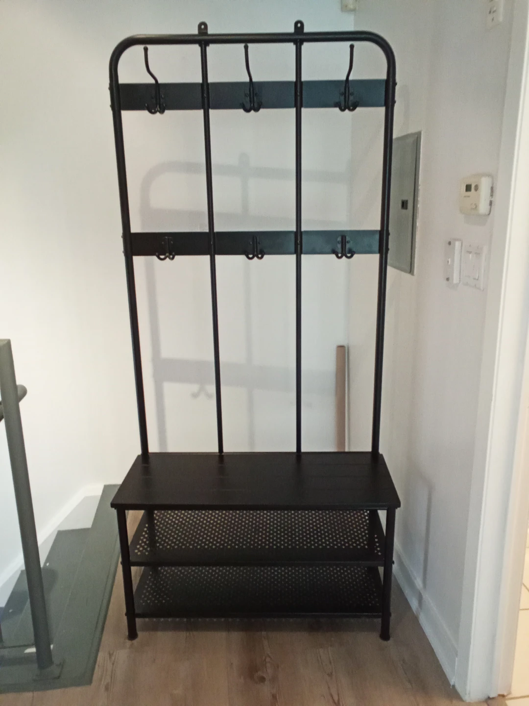 Ikea metal entryway bench with shoe organizer and jacket hooks