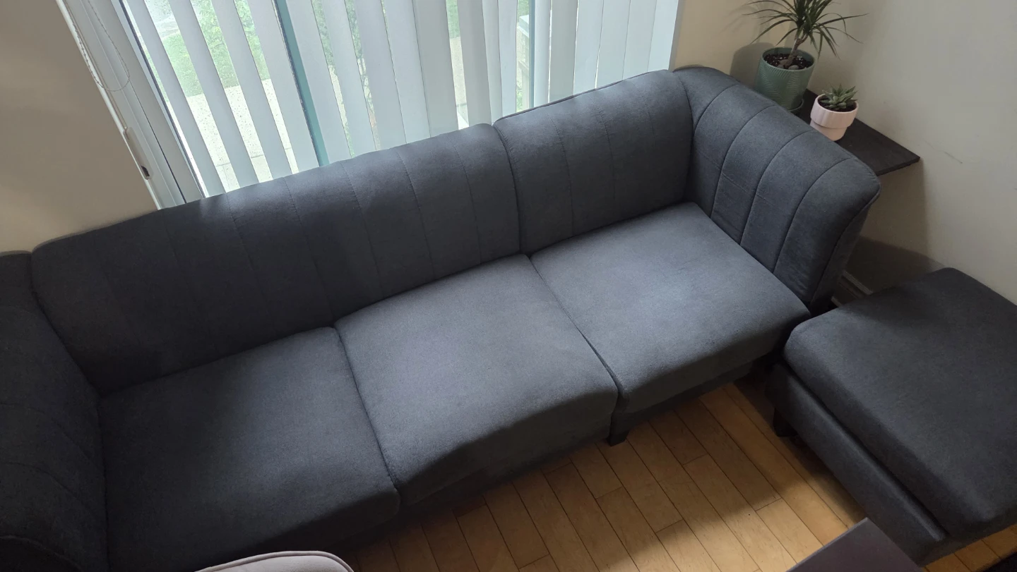 Dark grey fabric sofa with ottoman