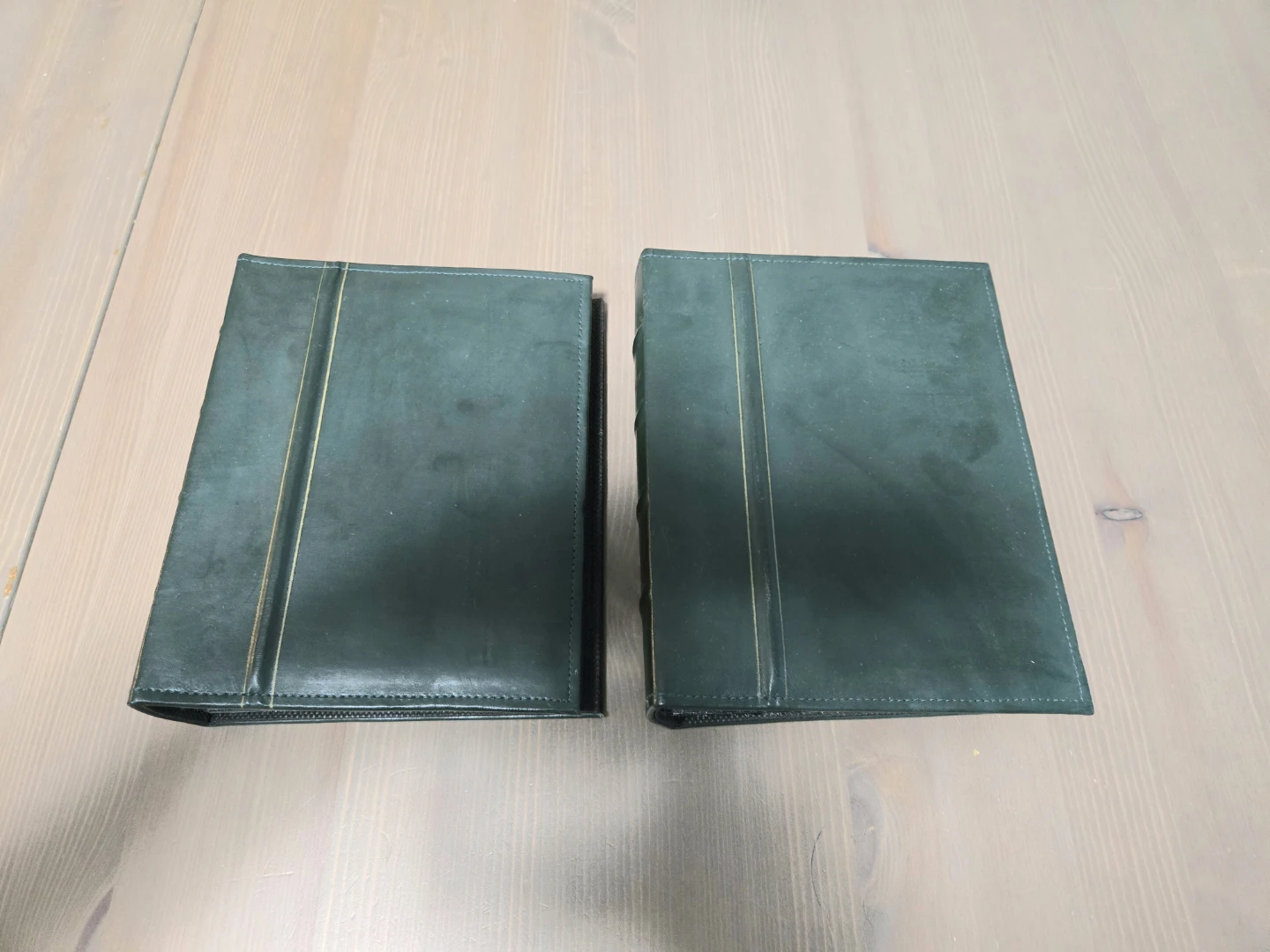Two dark green photo albums