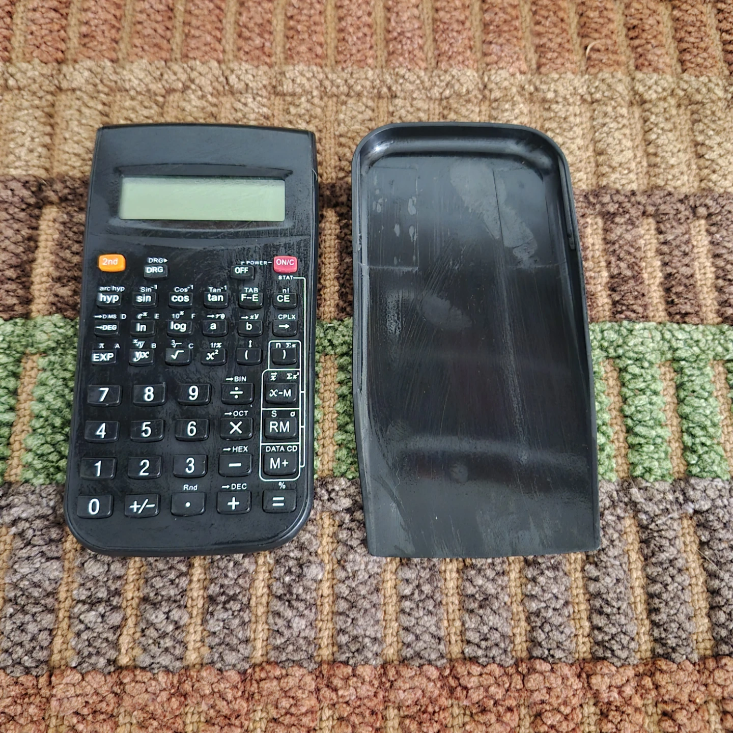 Black scientific calculator with protective cover