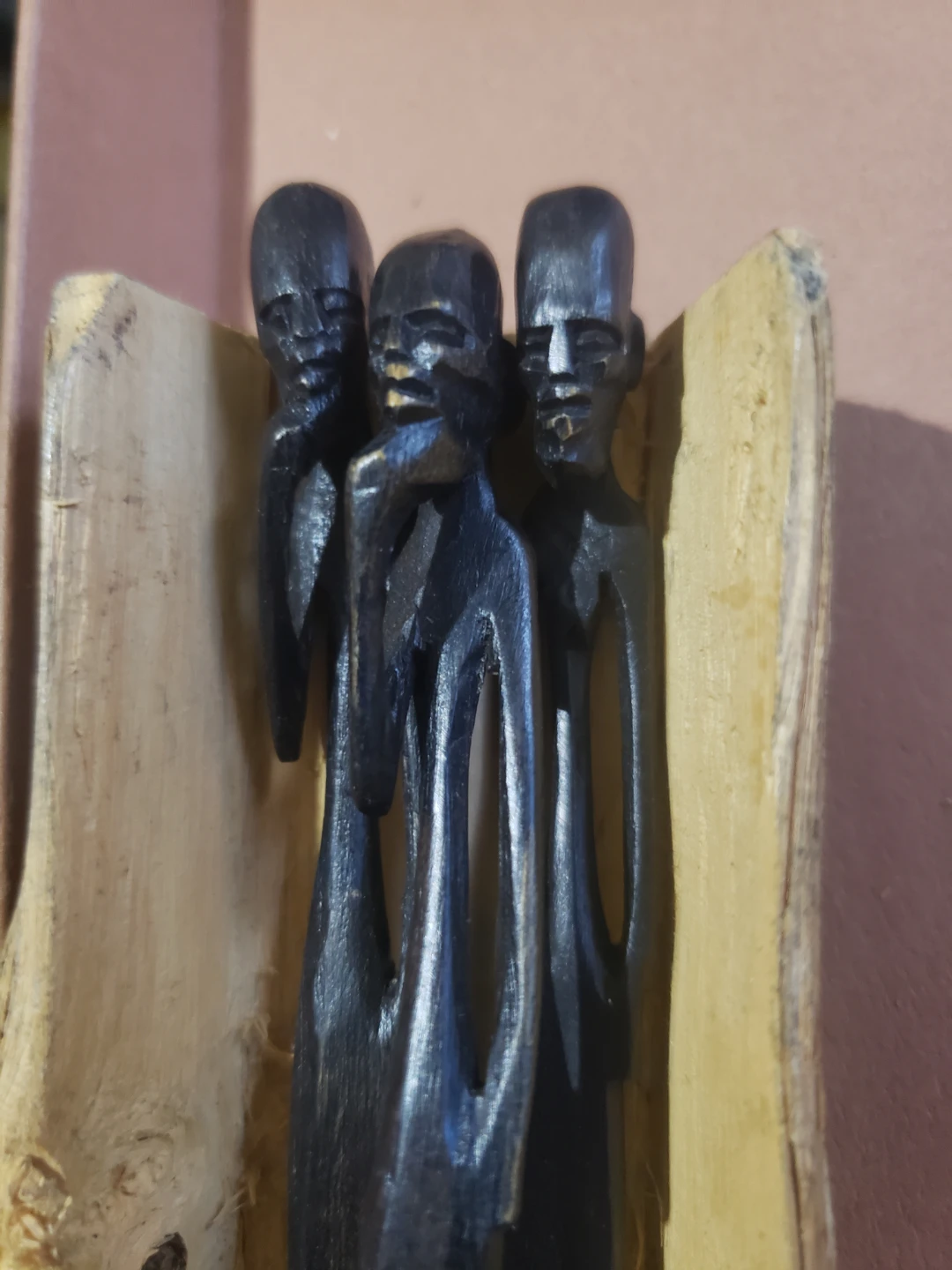 Wooden Carving of Three Figures