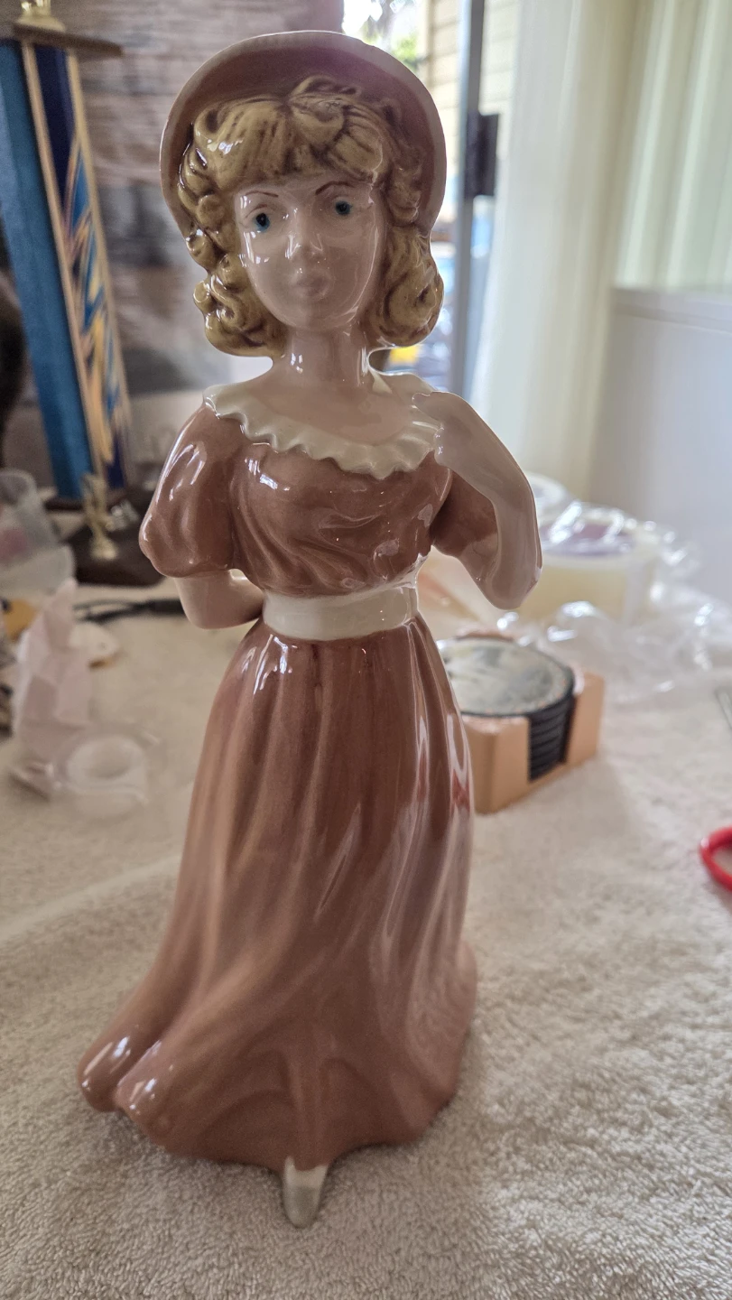 Porcelain Victorian lady figurine in pink dress