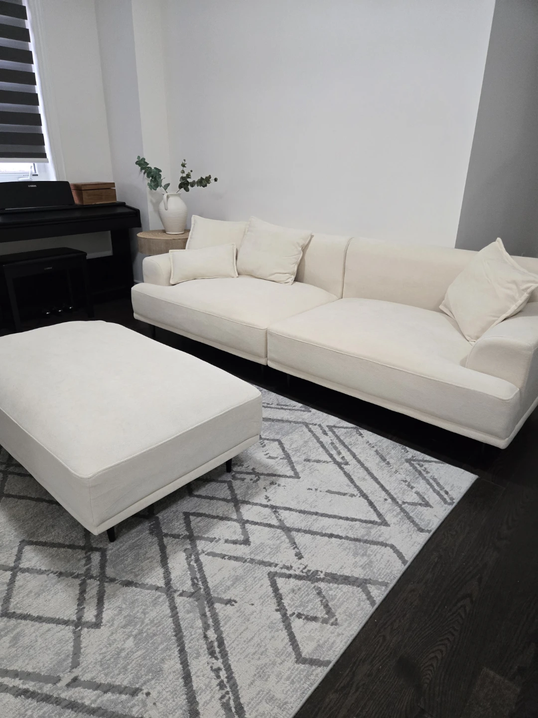 Cream coloured sofa with matching ottoman