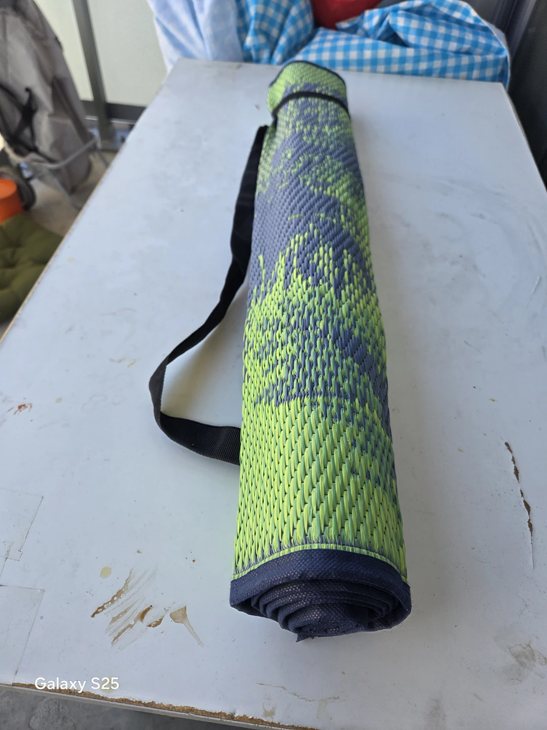 Rolled up yoga mat with strap