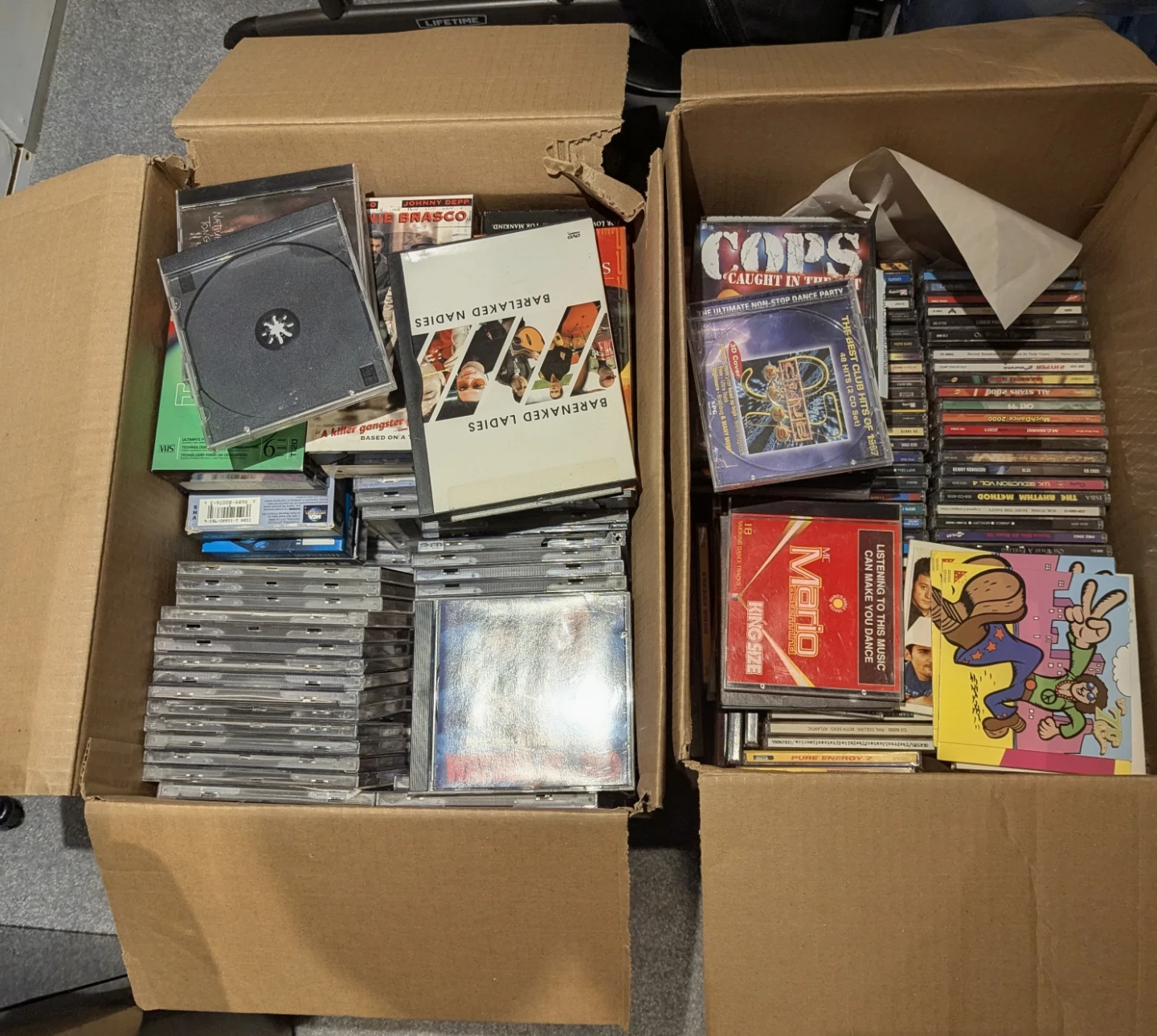 Bundle of CDs, VHS tapes, and DVDs