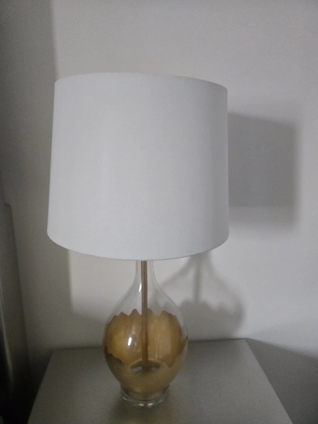 Clear Glass Lamp with Gold Accent and White Circular Shade