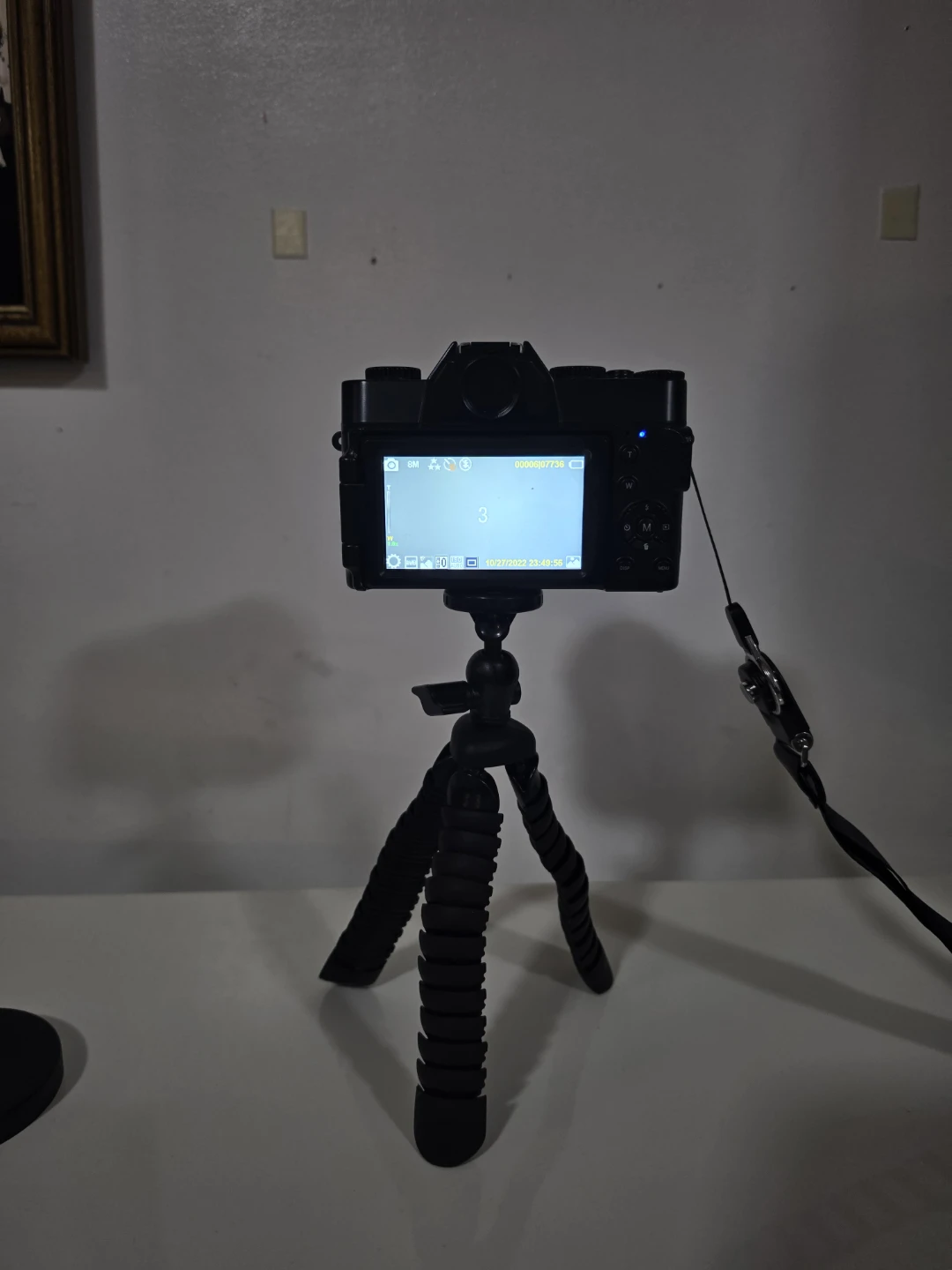 Black Digital Camera with Mini Tripod