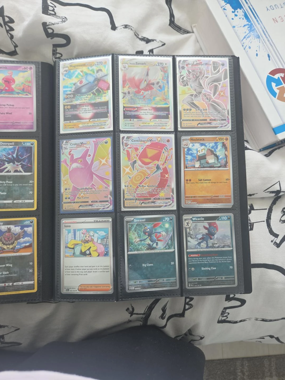 Assorted Pokémon Trading Cards in Binder
