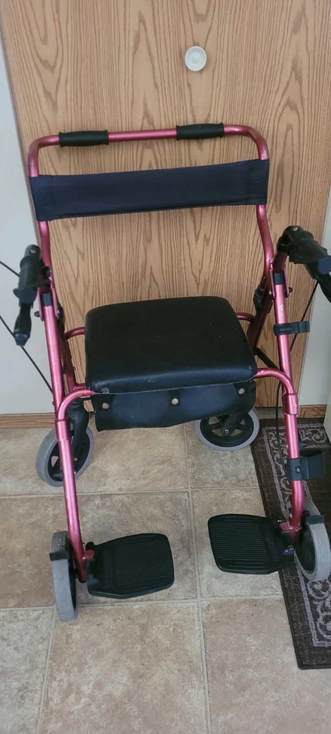 Pink Walker with Seat and Footrests