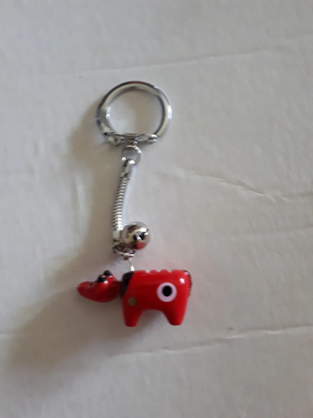 Red cartoon animal keychain with bell