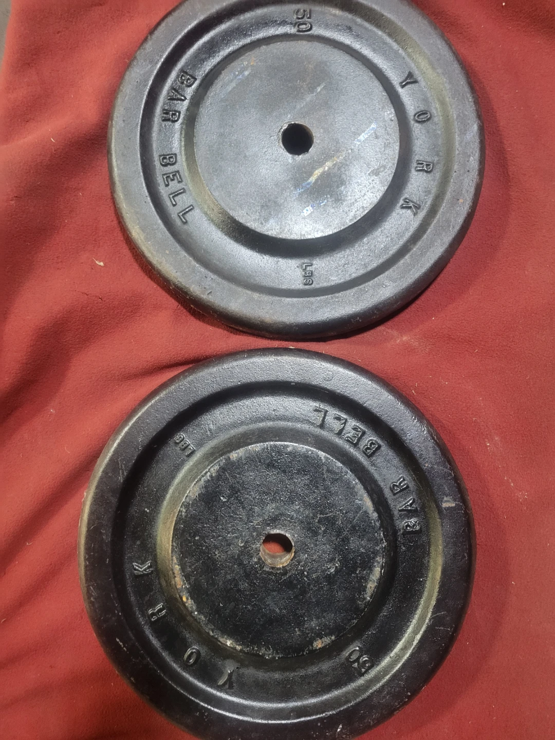 1" HOLE  50LB PLATES  TOTAL 100lbs  2-50s