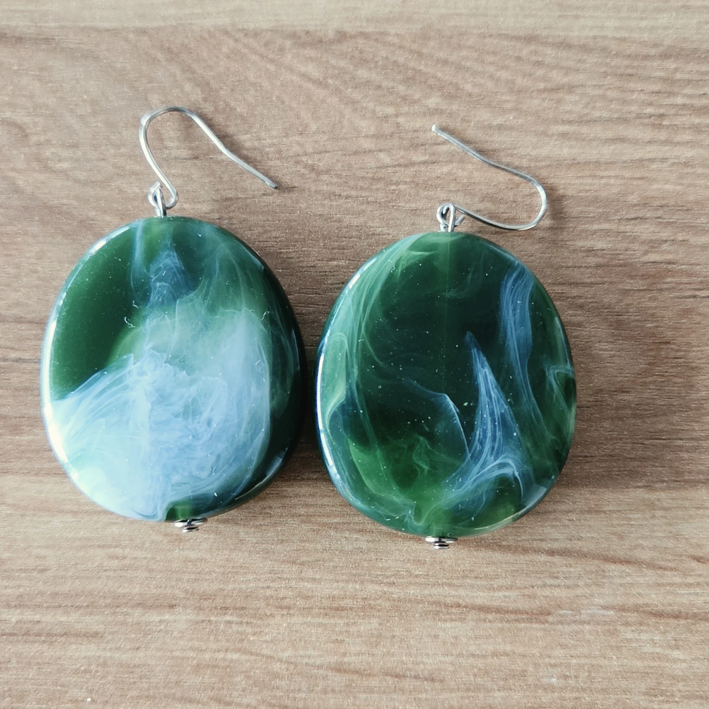 Two sets of dangle earrings