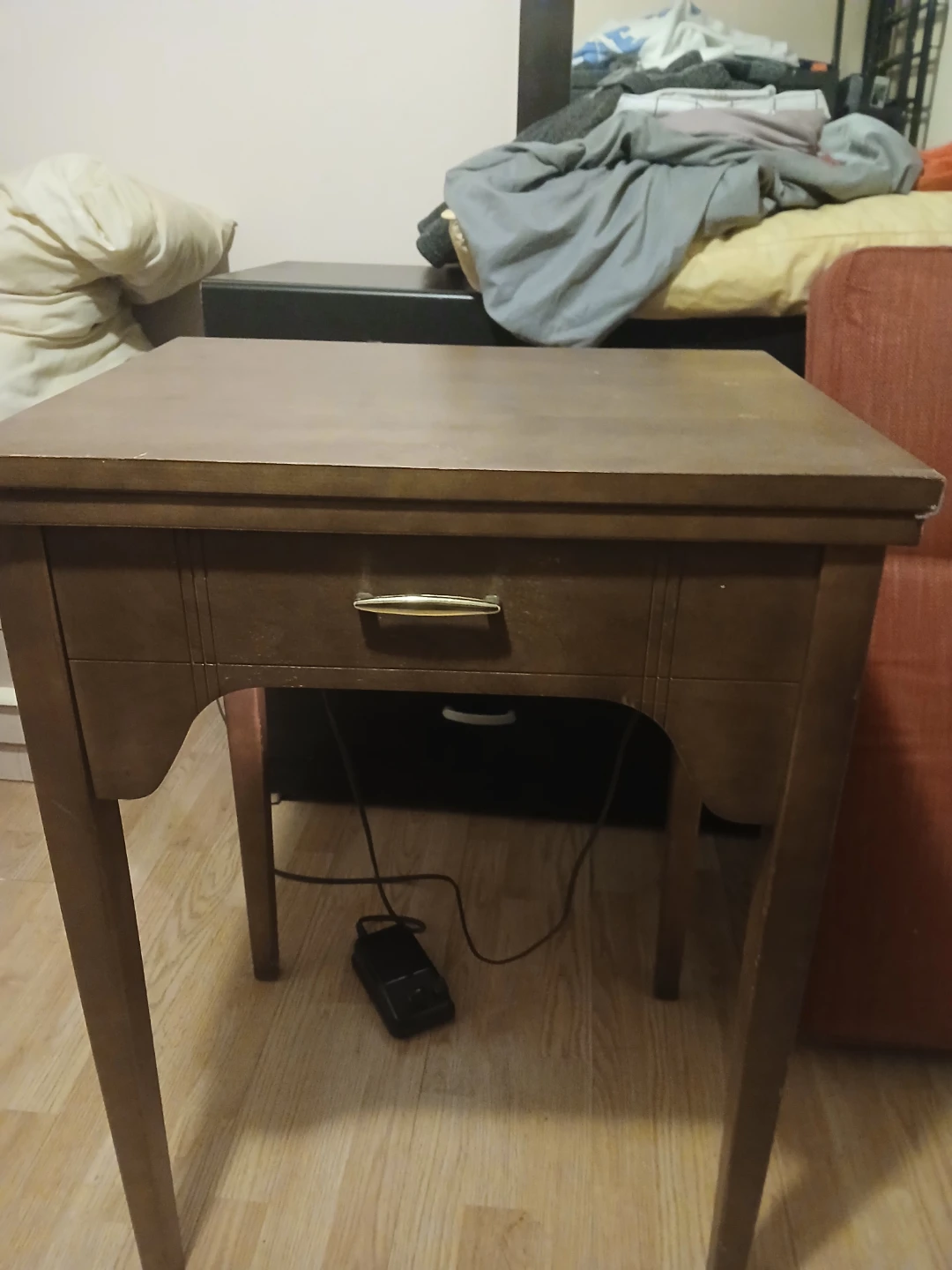 Vintage sewing machine with wood cabinet