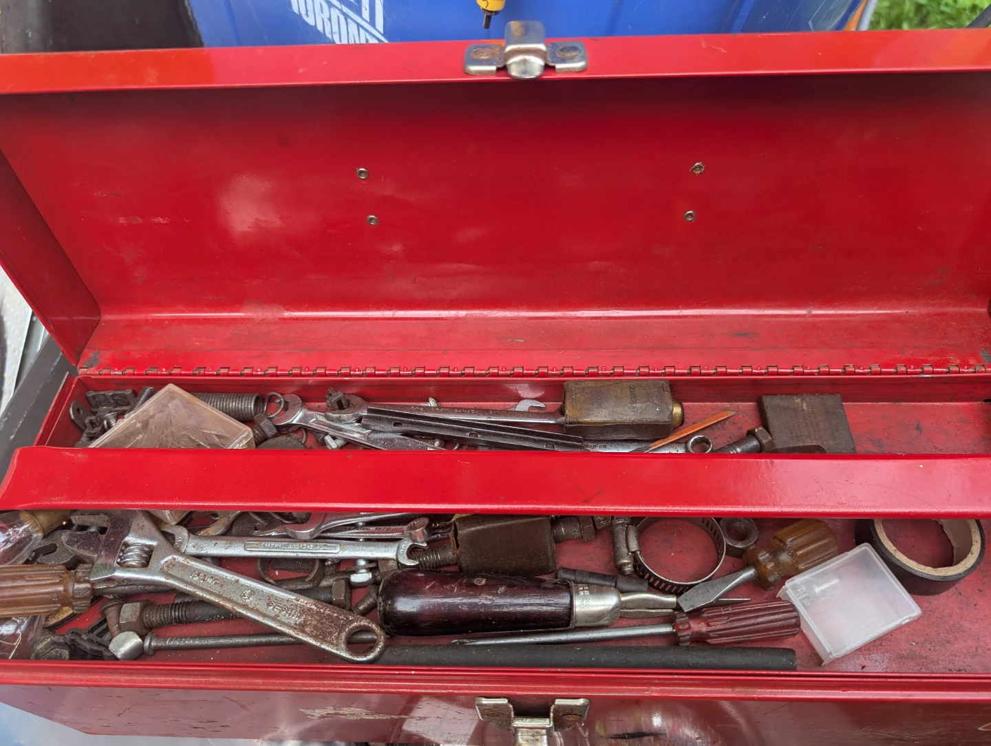 Red Metal Toolbox with Assorted Tools