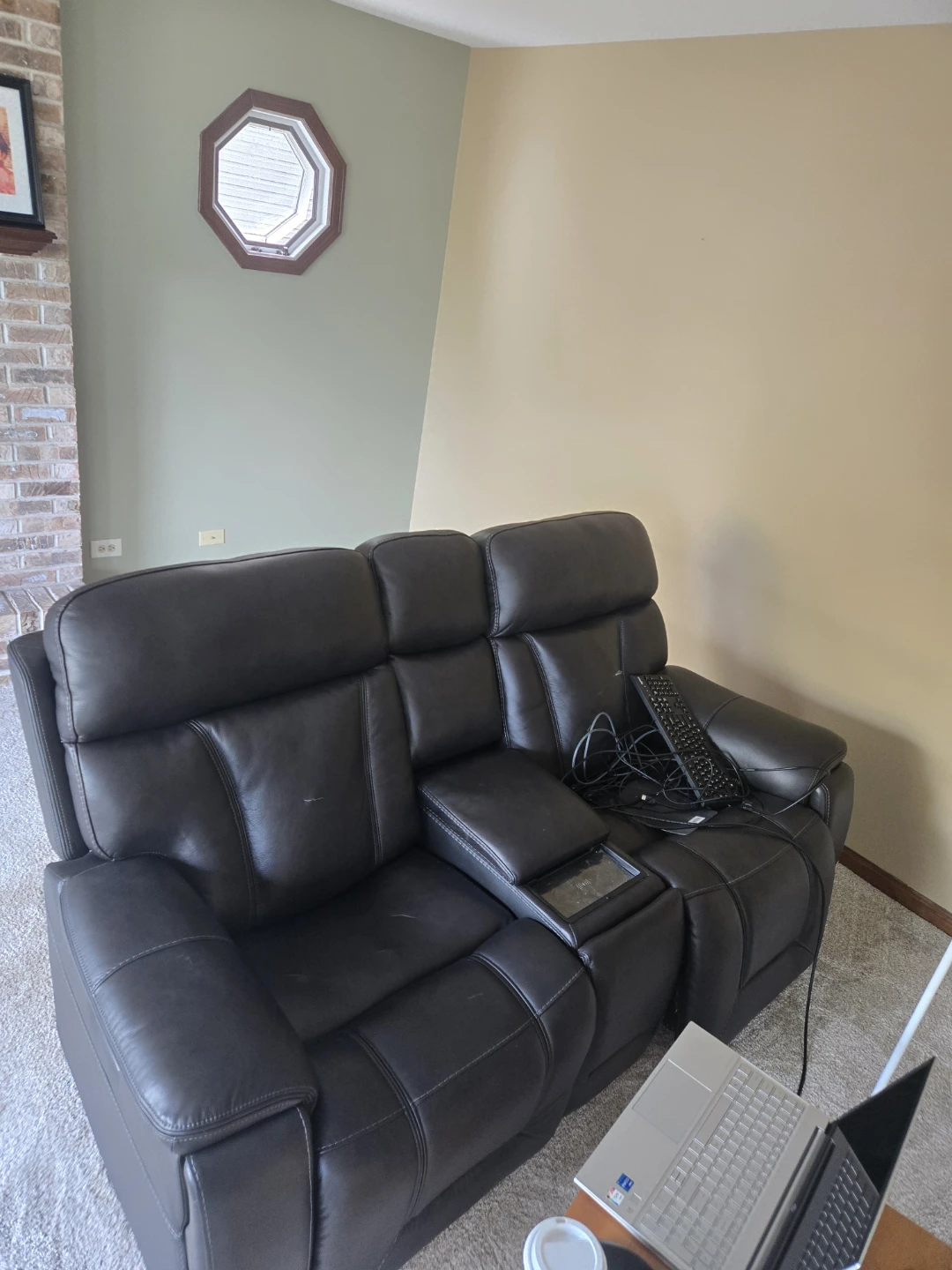 Black faux leather Loveseat.  Some tears, no powercord.
