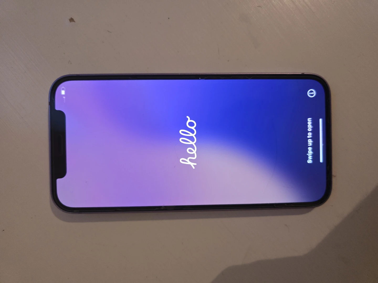 iPhone 12 Purple 64 GB - Cracked Back and camera, works great.