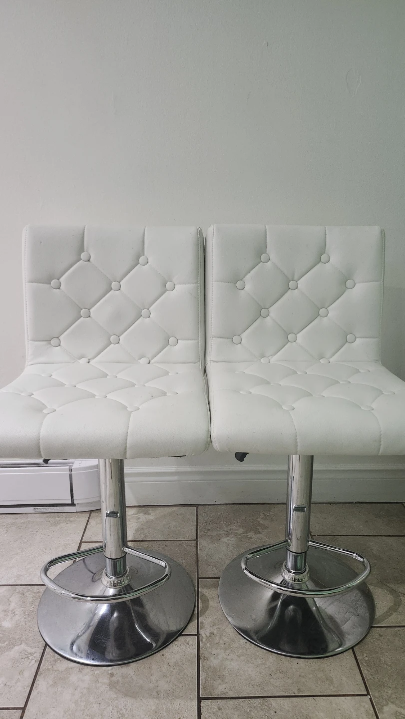 Set of two white tufted bar stools