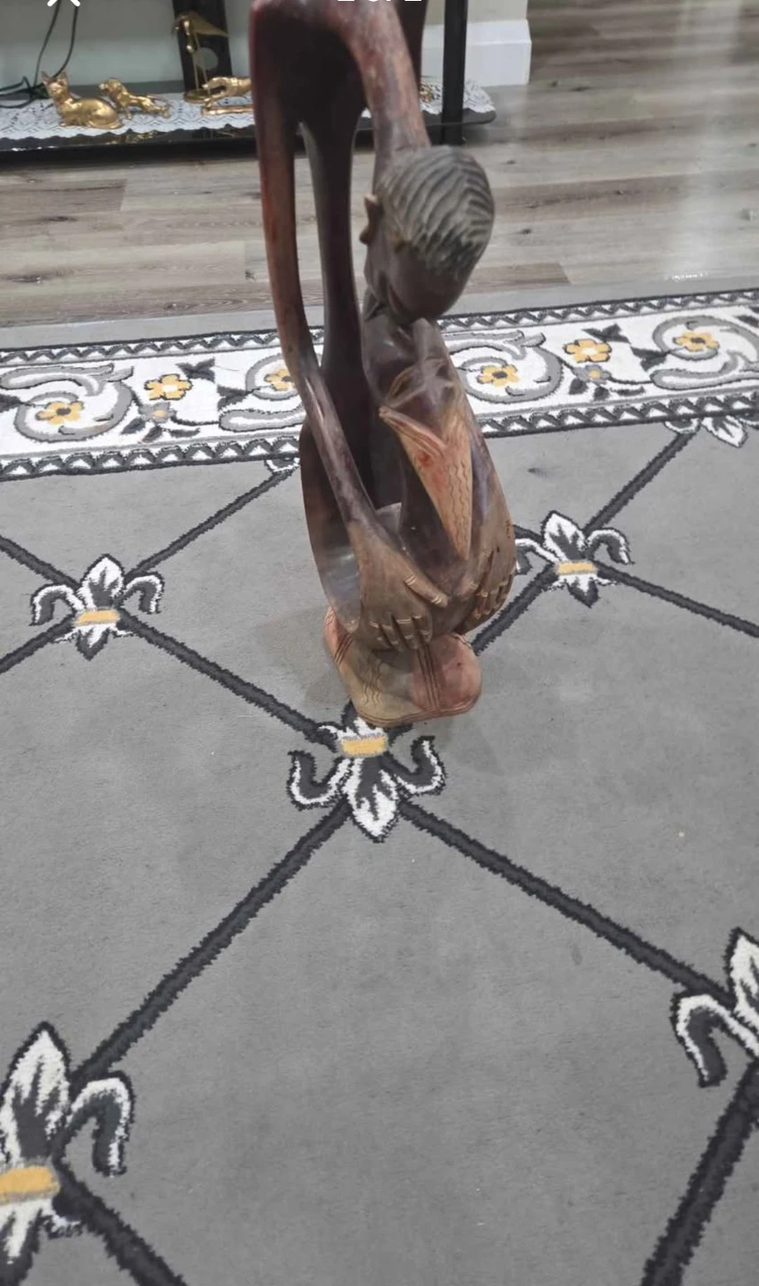 Wooden Carving of a Person Holding a Fish - photo 2